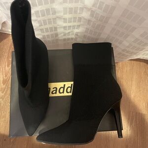 Black half calf boots. Contour/sock fit. Sexy fashionable with versatility.